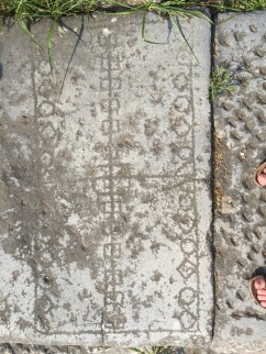 Game--board from Roman Philippi and the classic archaeologist foot selfie (Photo by Sarah E. Bond)